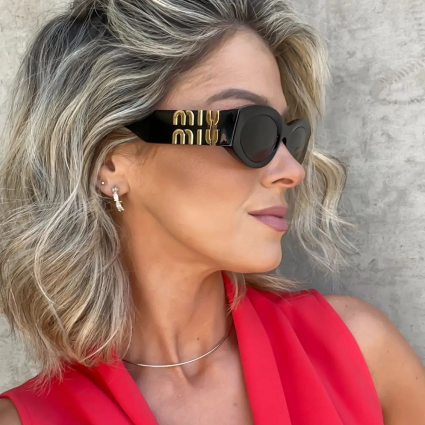 MM Cat-Eye-Sonnenbrille mit Logo